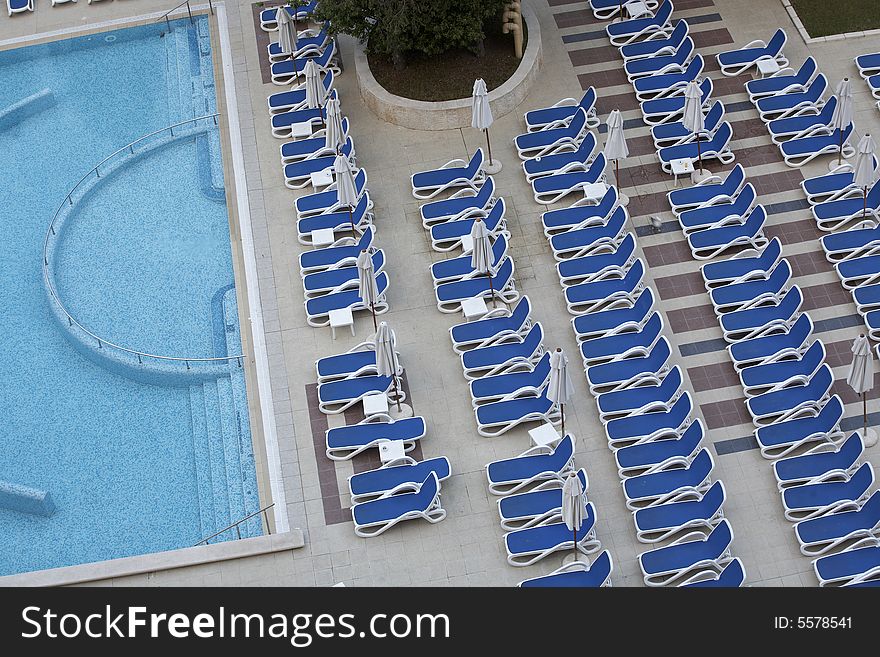 Chairs by swimming pool side. Chairs by swimming pool side