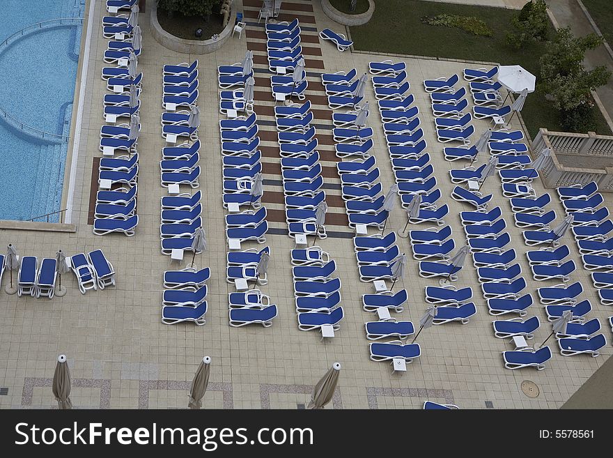 Chairs by swimming pool side. Chairs by swimming pool side