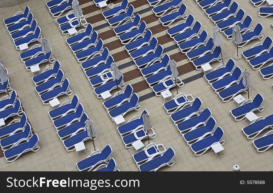 Chairs by swimming pool side. Chairs by swimming pool side