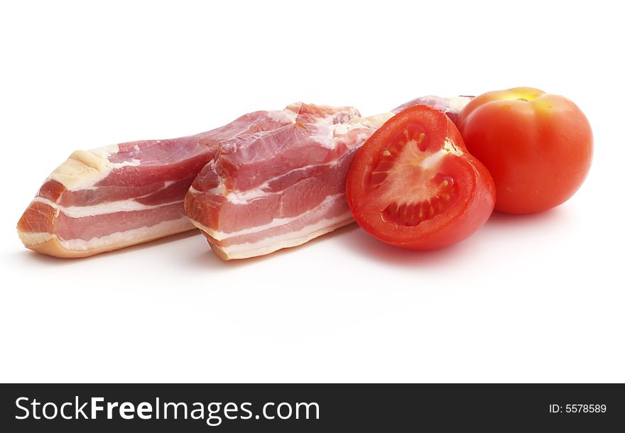 Raw smoked bacon with tomatoes isolated on the white background