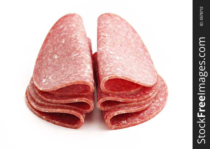 Stack from sausage slices isolated on the white background