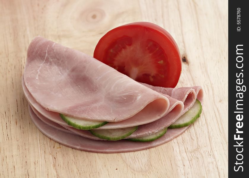 Ham With Vegetables On Wooden Board