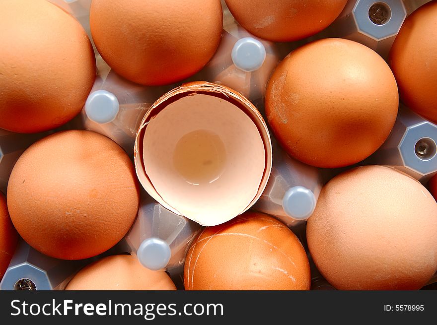 A set of brown eggs in a plastic tray. A set of brown eggs in a plastic tray