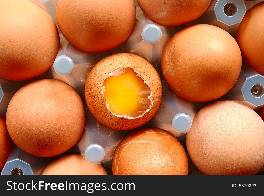 A set of brown eggs in a plastic tray. A set of brown eggs in a plastic tray