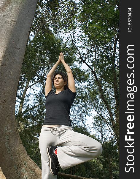 Woman Performing Yoga - Vertically framed sh