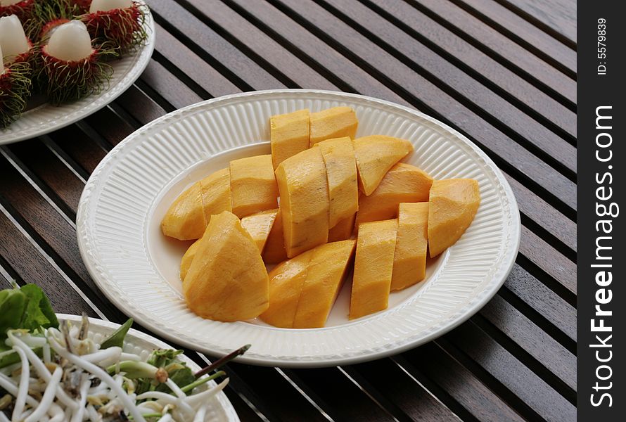 Plate of fresh tropical mango on a plate.