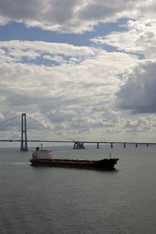 Cargo Ship, Having Just Passed Under A Bridge Royalty Free Stock Images