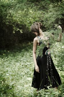 Girl In Black Dress In The Woods Stock Photos