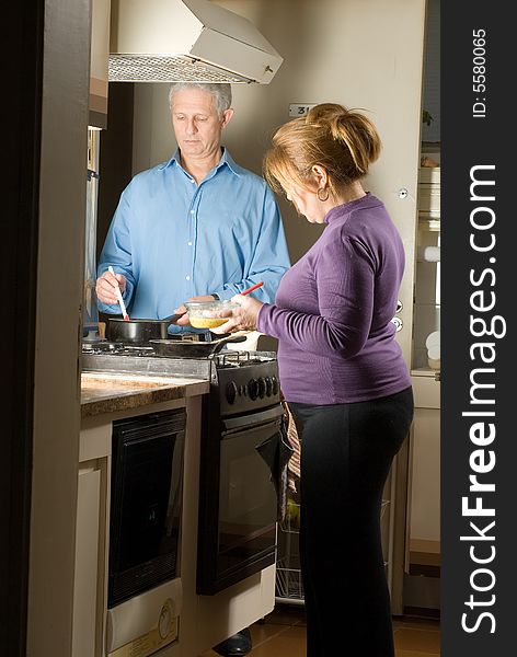 Couple Preparing Meal - Vertical