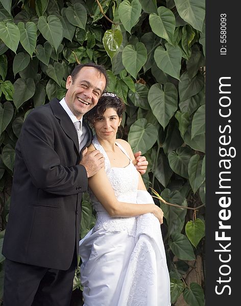 Newly Married Couple Smile At Camera - Vertical