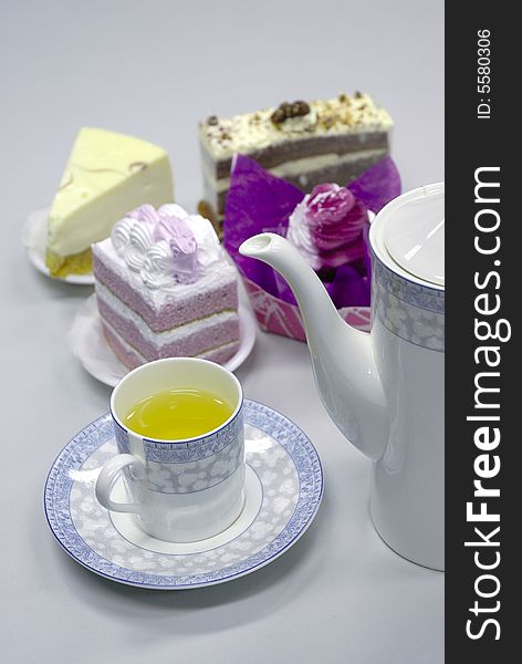 Tea with cake on white