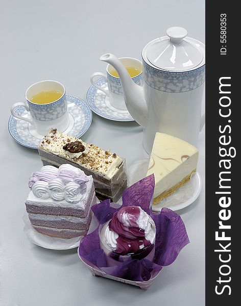 Tea with cake on white
