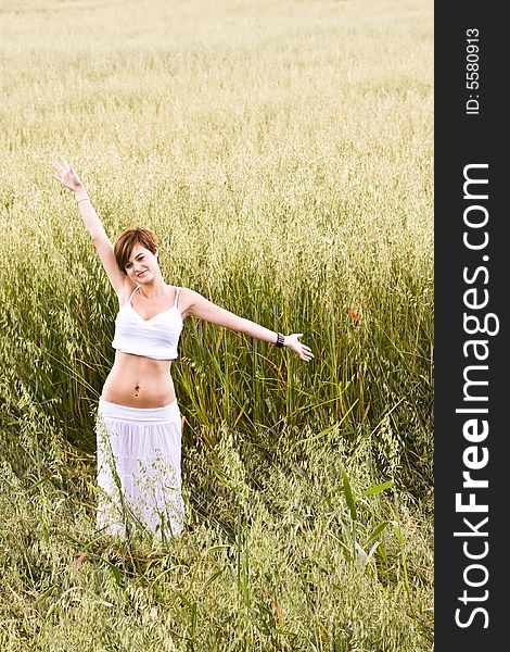 Woman feeling freedom in a field. Woman feeling freedom in a field.
