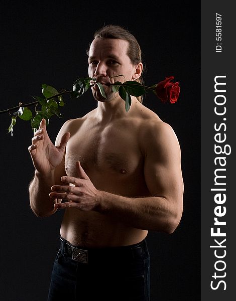 Standing romantic man with red rose. Standing romantic man with red rose