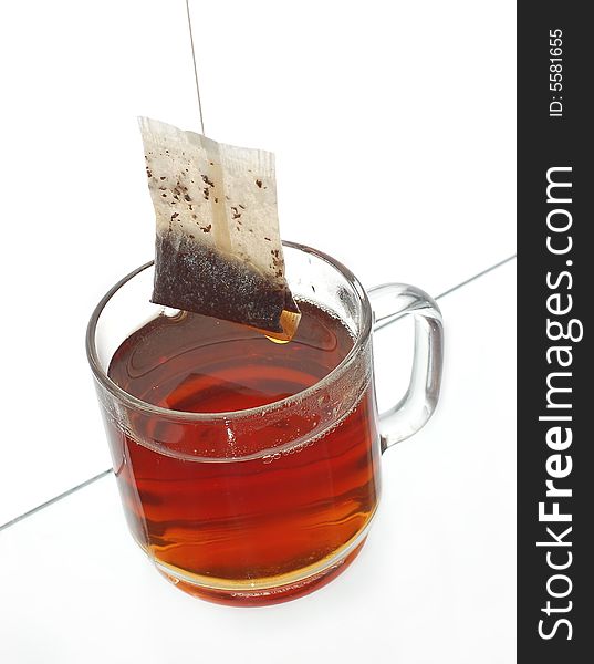 Transparent cup of tea with tea bag