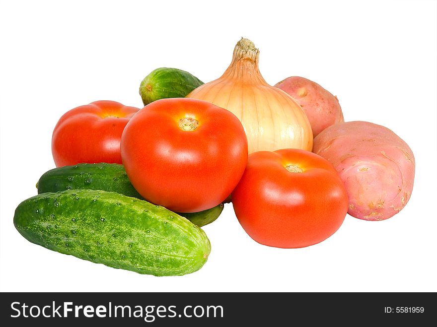 Cucumbers, tomatoes, potato and  onion on a white background. Cucumbers, tomatoes, potato and  onion on a white background