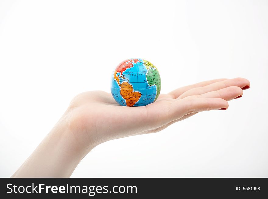 The globe in a hand on a white background. The globe in a hand on a white background