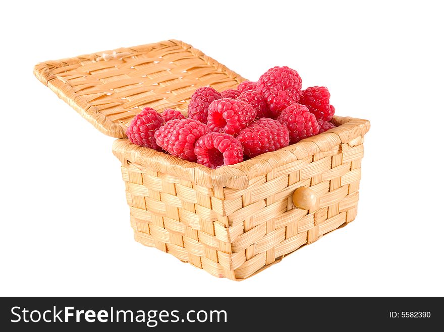 The bast-basket with a raspberry is photographed on a white background