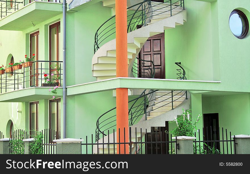 Green building with outdoor spiral staircase. Green building with outdoor spiral staircase