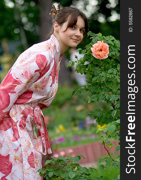 Girl in a pink yukata with rose. Girl in a pink yukata with rose