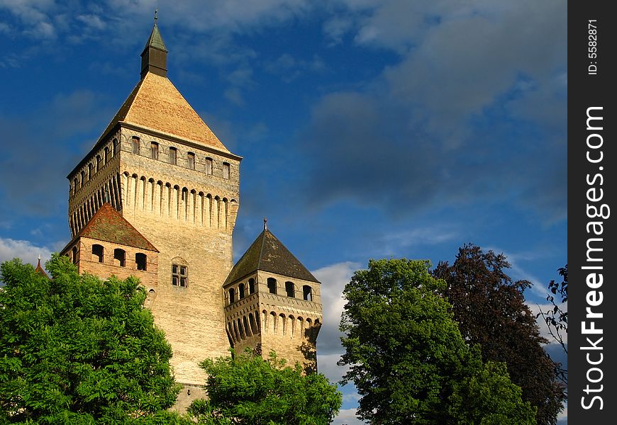 Build in the 15th century castle in North Italian style, is one of the most magnificent Gothic fortresses in Switzerland. It is currently privately owned and under renovation. In the picture, only the main turreted keep against dramatic sky colors. Build in the 15th century castle in North Italian style, is one of the most magnificent Gothic fortresses in Switzerland. It is currently privately owned and under renovation. In the picture, only the main turreted keep against dramatic sky colors.