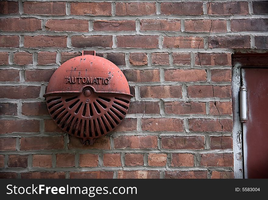 Closeup of automatic security system on brick wall