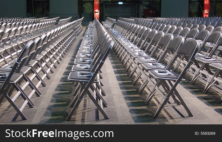 Many chairs put in rows for a congress. Many chairs put in rows for a congress