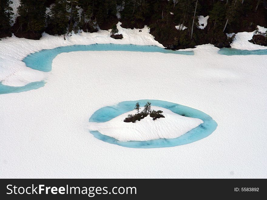 Mountain frozen pick with blue water in ketchikan alaska . Mountain frozen pick with blue water in ketchikan alaska