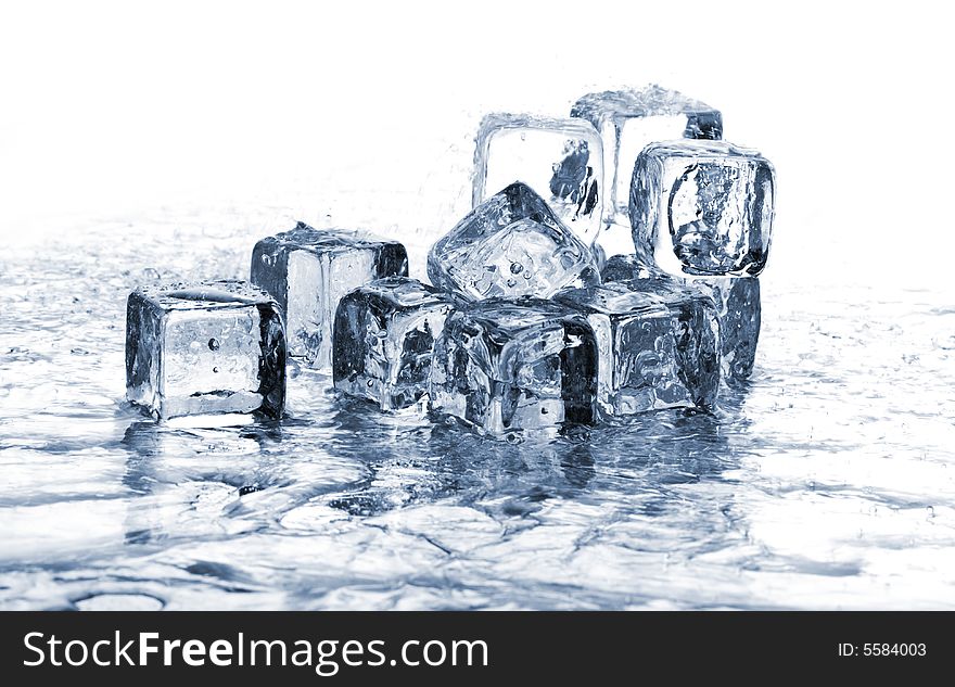 Melting ice cubes in water on white background