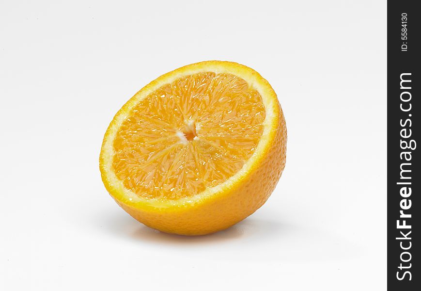 A single sliced orange on white background