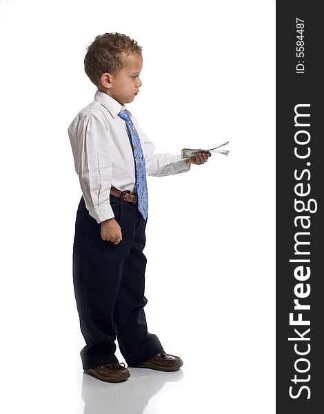 Young boy dressed as businessman holds money