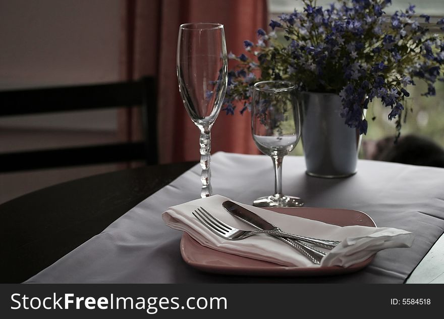 A table for dinner backlit by a window. A table for dinner backlit by a window