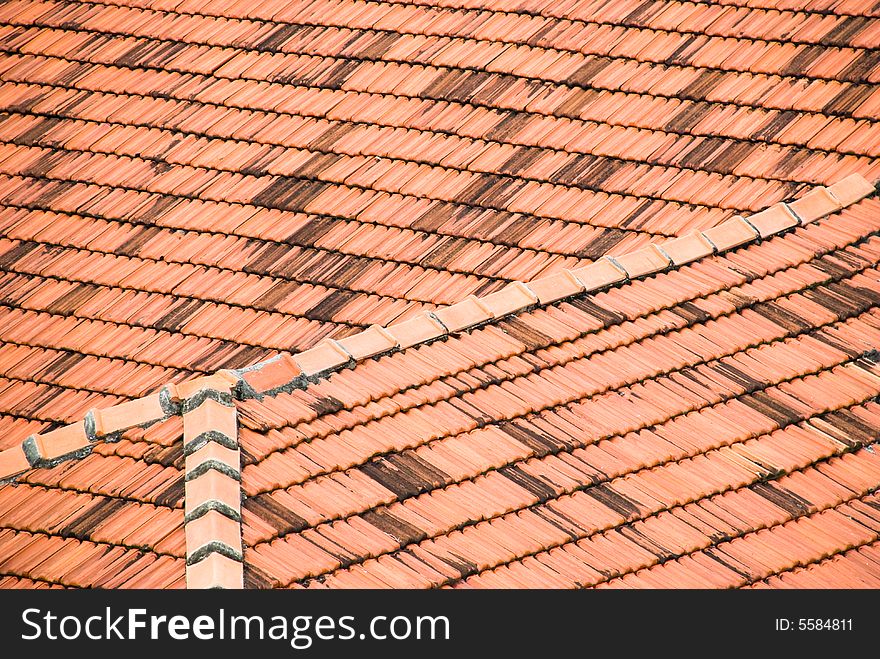 Abstract of red tiled roofs ninety degrees apart