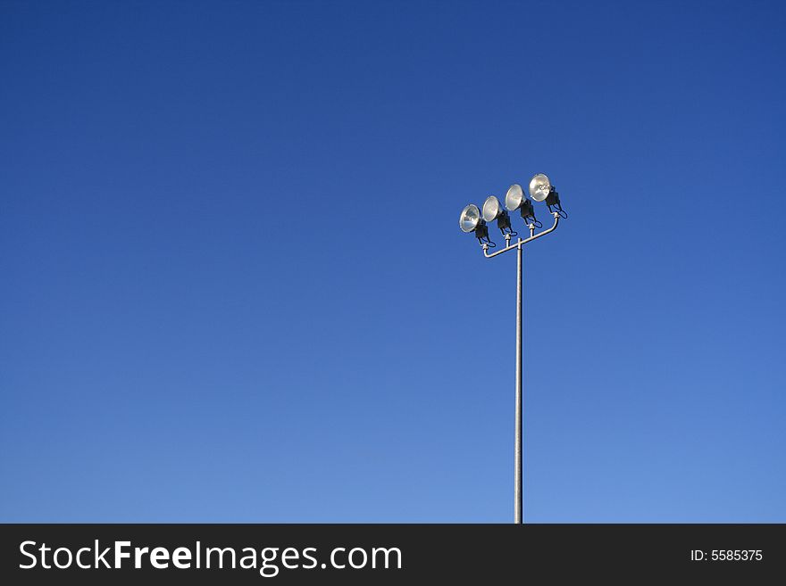 Sunny sky at California, with a pole of floodlight. Sunny sky at California, with a pole of floodlight