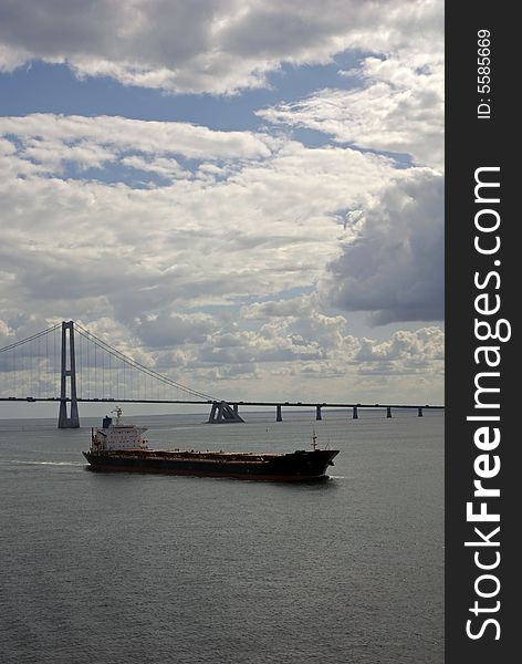 Cargo Ship, Having Just Passed Under A Bridge