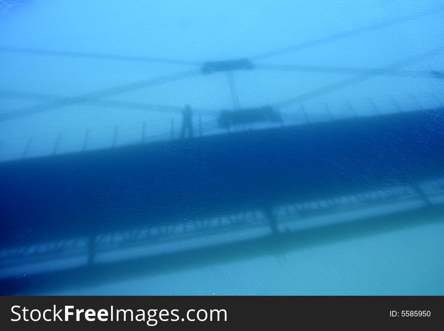 Bridge's shadow on the Euphrates river. Bridge's shadow on the Euphrates river