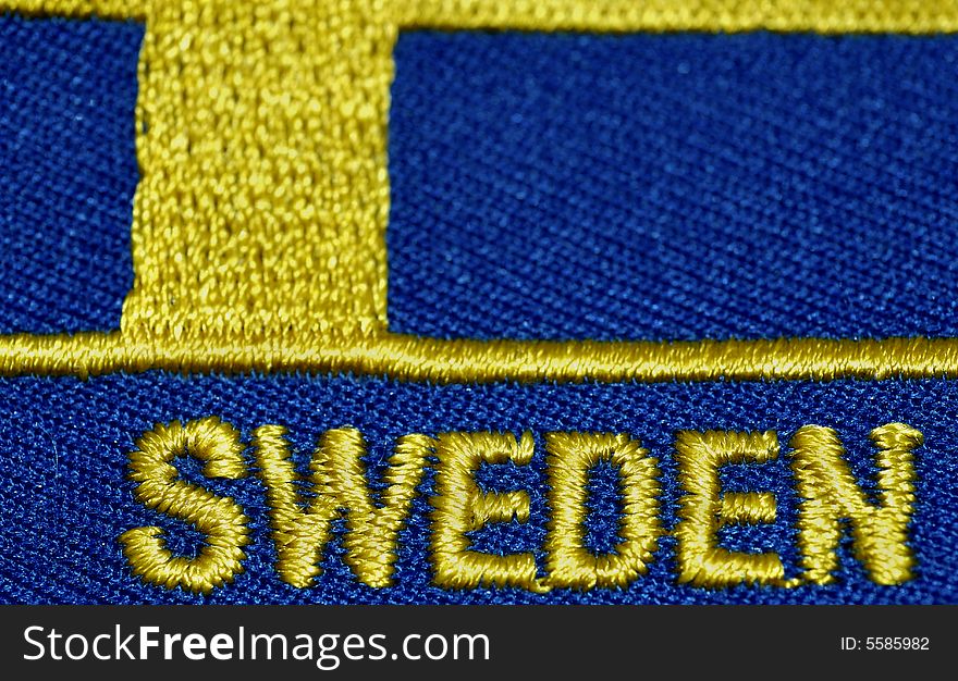 Close up of a stitched flag of Sweden. Close up of a stitched flag of Sweden