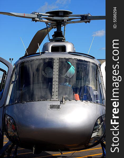 Medical helicopter stationary against sky with front view