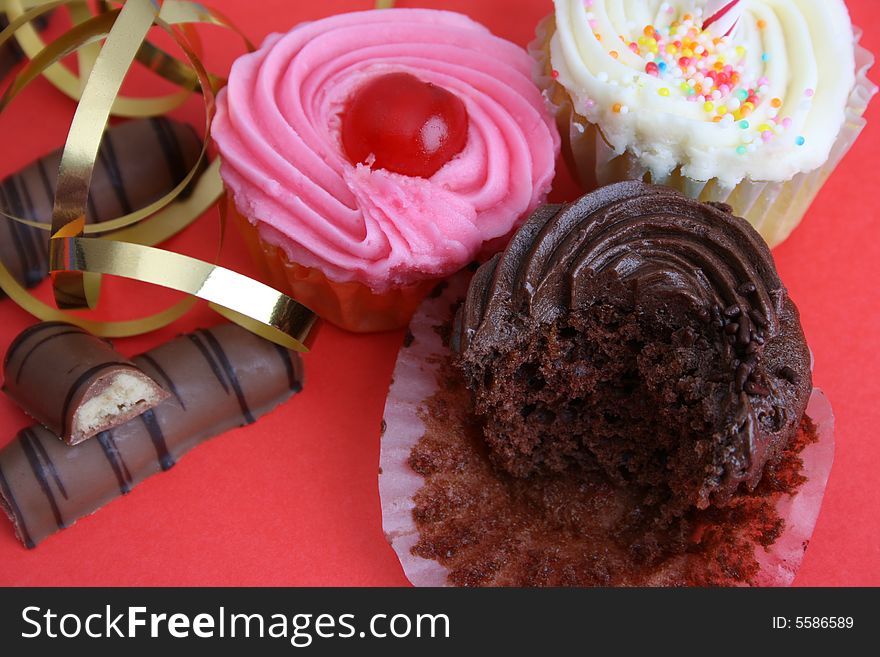 Birthday Cupcakes and chocolate sticks with gold ribbon