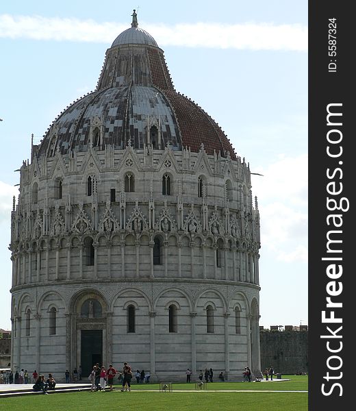 The Baptistery -  The Baptistery is a circular building designed by the architect Diotisalvi with a truncated cone shaped dome roof crowned by a statue of John the Baptist.  Construction began in 1152 and was not completed until the mid 14th Century. The Baptistery -  The Baptistery is a circular building designed by the architect Diotisalvi with a truncated cone shaped dome roof crowned by a statue of John the Baptist.  Construction began in 1152 and was not completed until the mid 14th Century