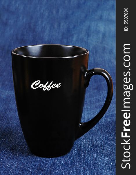 A coffee mug isolated on blue.