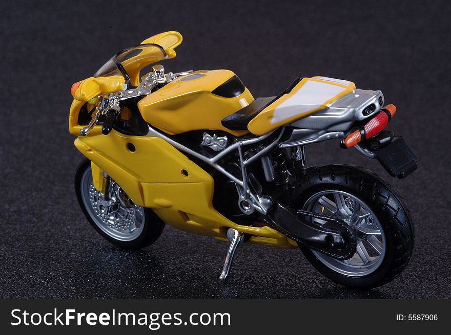 A yellow superbike scale model.