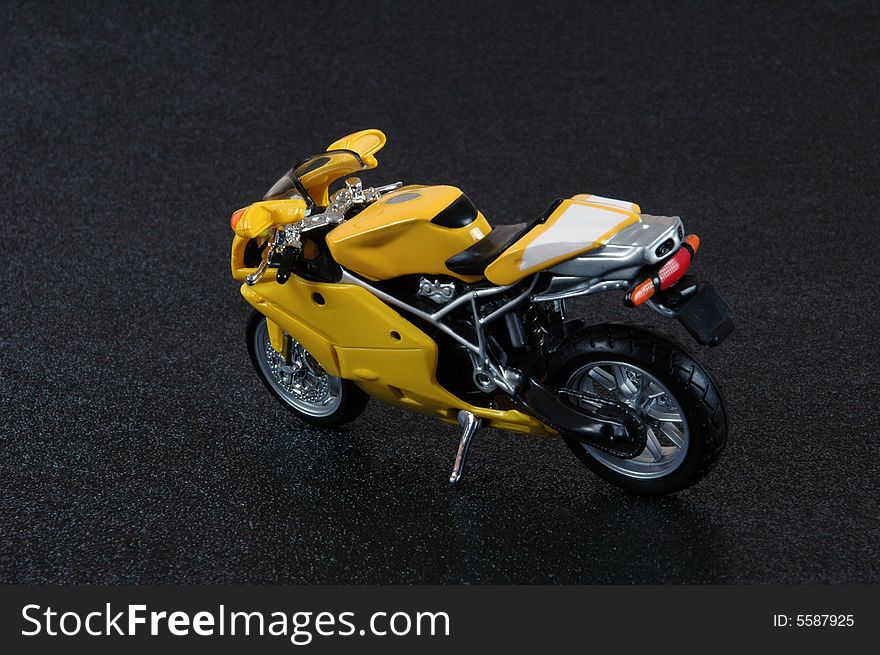 A yellow superbike scale model.