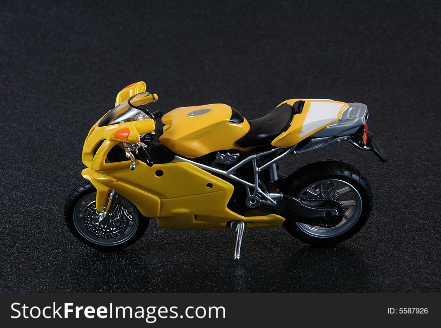 A yellow superbike scale model.