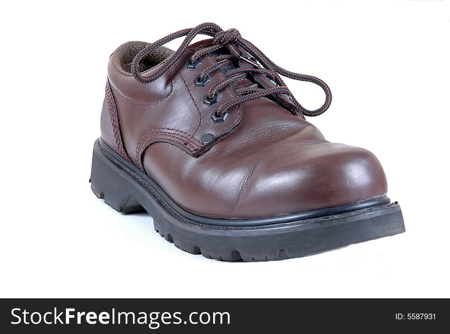 A leather shoe isolated on white.  Photographed in a studio.