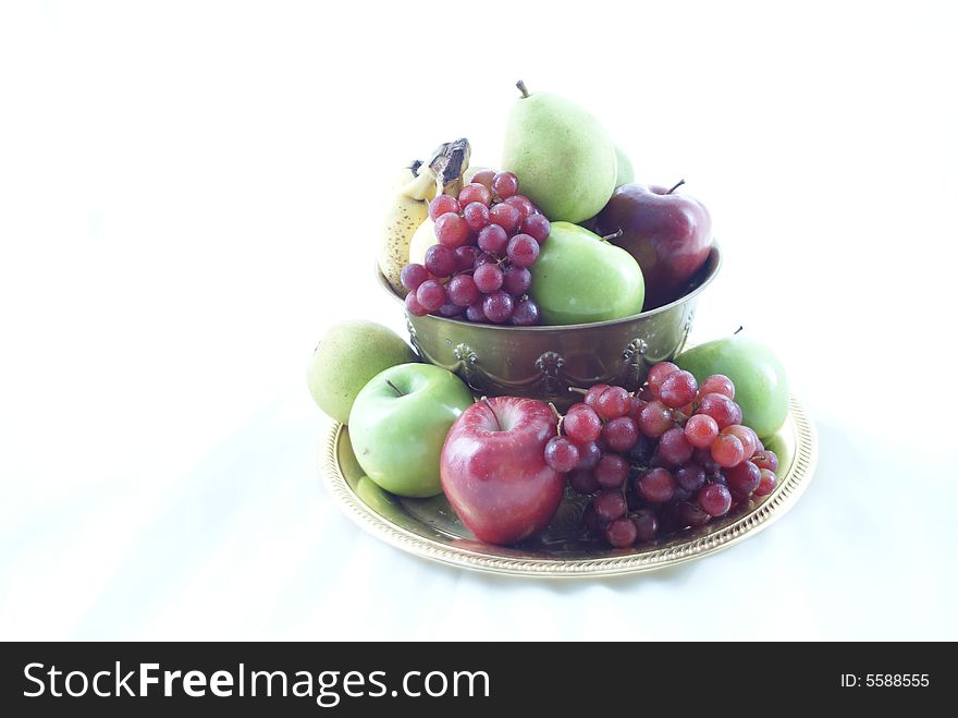 Bowl of various fruit against a white background. High Key. Bowl of various fruit against a white background. High Key