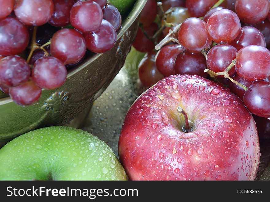 Closeup image of red and green apples and red grapes. Closeup image of red and green apples and red grapes.