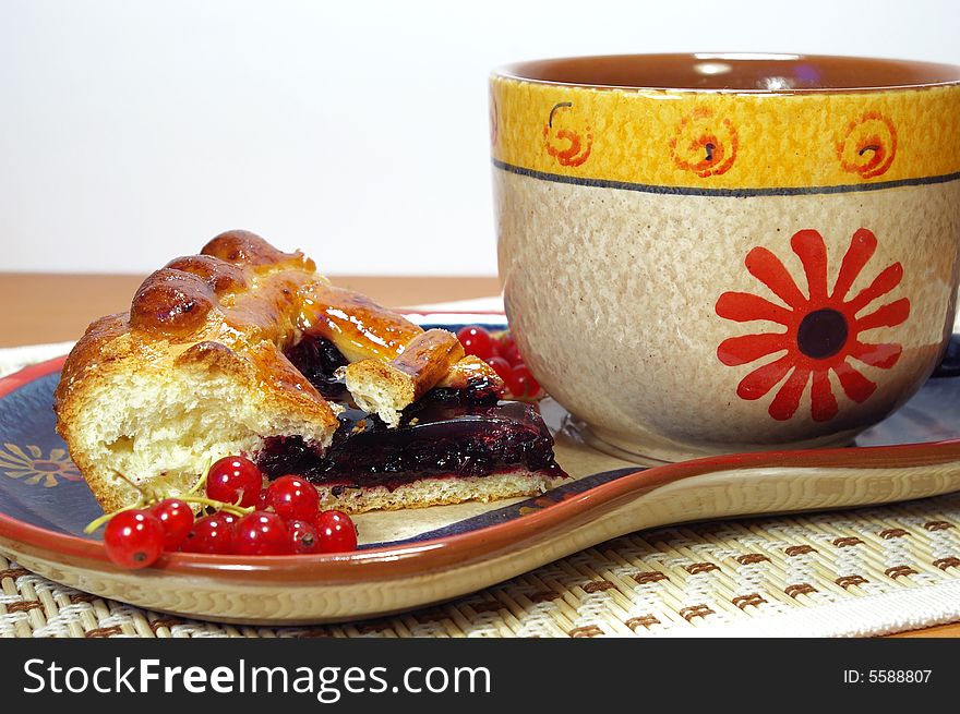 Fresh sweet pie with bilberry and cup of tea. Fresh sweet pie with bilberry and cup of tea