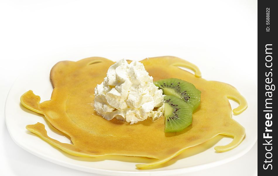 Pancakes filled with whipped cream cheese and kiwi. Pancakes filled with whipped cream cheese and kiwi