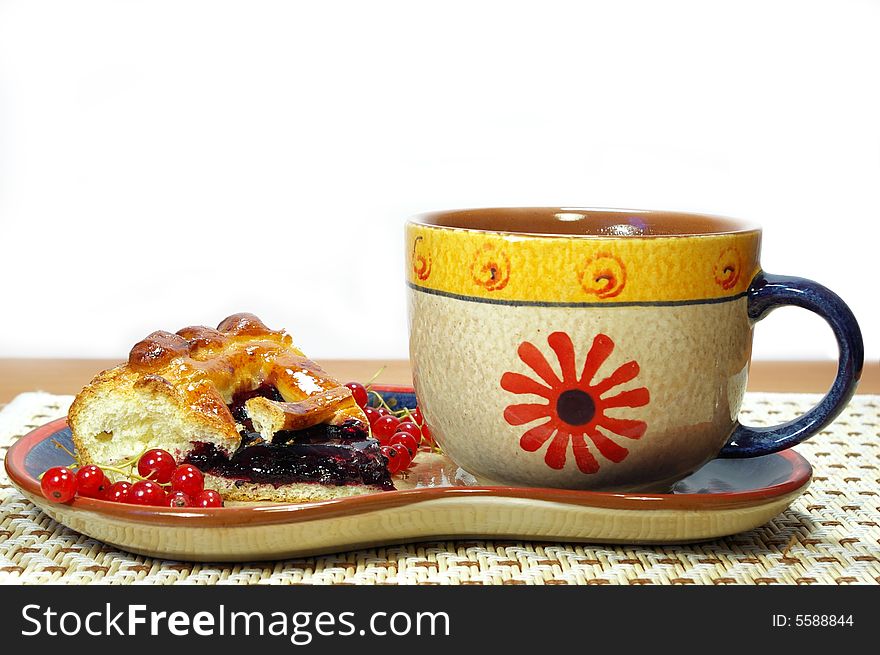 Fresh sweet pie with bilberry and cup of tea